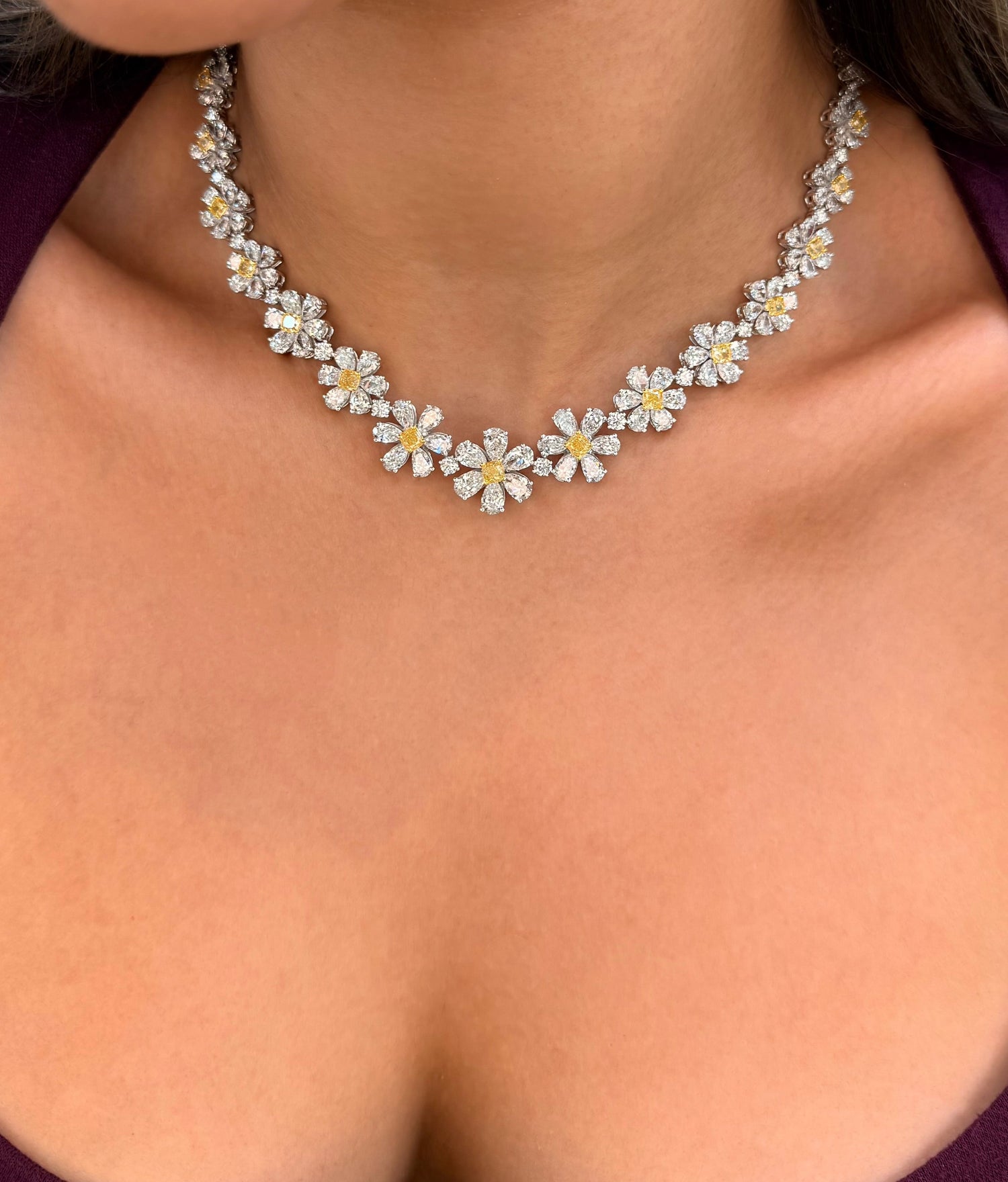 Necklace with floral design worn by a person