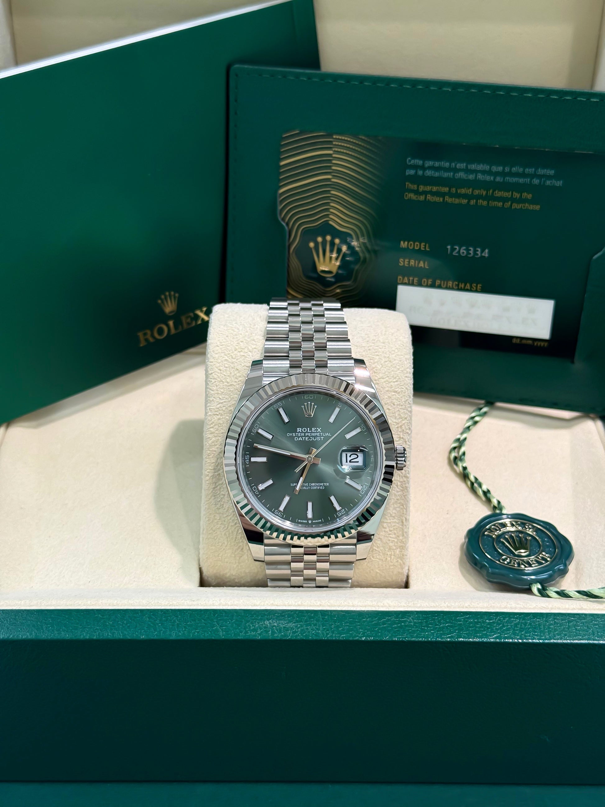 126334 ROLEX datejust 41mm New, Stainless Steel Jubilee band with 18K White gold fluted bezel. Green index dial. Mint green dial. Date just II. 