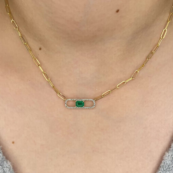14K Solid Yellow Gold necklace with a green Emerald and diamond gemstone pendant on a white background. Trendy 14K yellow gold Paperclip necklace. 